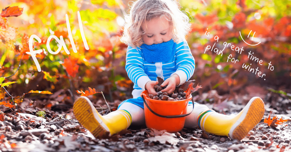 Girl playing in leaves
